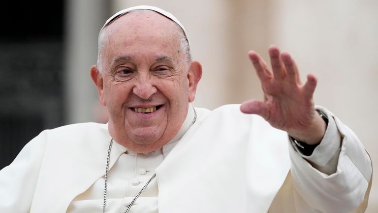 Pope Francis waves as he leaves his weekly general audience in St Peter's Square on Wednesday.   Pic: AP/Gregorio Borgia