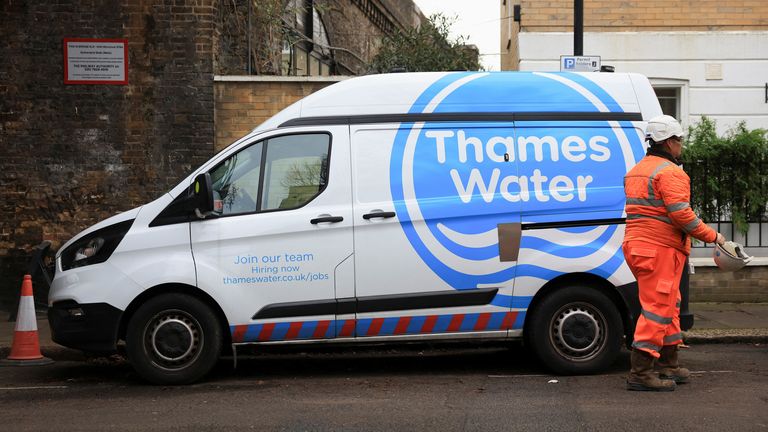 A Thames Water employee walks by a van as repair and maintenance work takes place, in London, Britain, December 16, 2024. REUTERS/Mina Kim