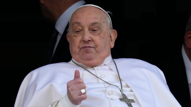 Pope Francis thus up as he appears at a window of the Agostino Gemelli Polyclinic in Rome, Sunday, March 23, 2025, where he has been treated for bronchitis and bilateral pneumonia since Feb. 14. (AP Photo/Domenico Stinellis)