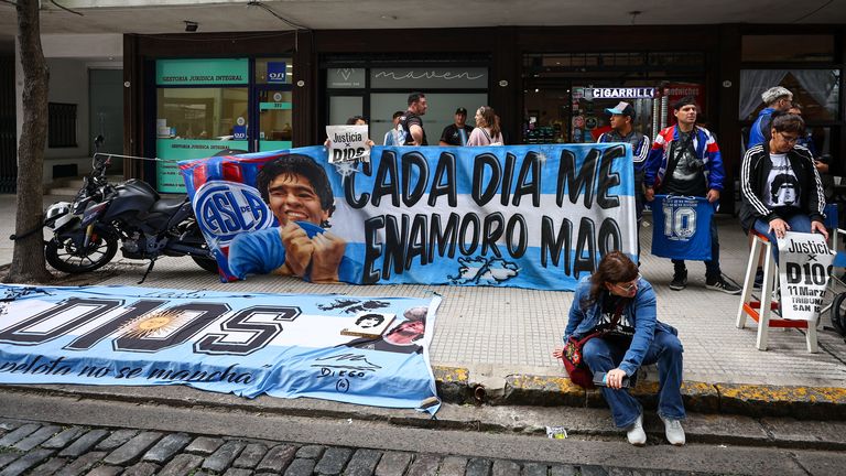Fans of Argentine soccer legend Diego Armando Maradona gather, on the day of a court case against people charged with Maradona's death, in Buenos Aires, Argentina, March 11, 2025. REUTERS/Agustin Marcarian
