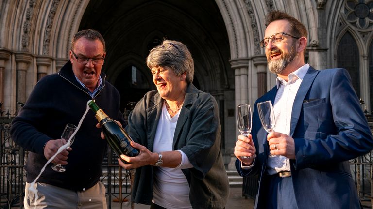 Mrs Durber with her husband Colin (left) and her lawyer Peter Coyle (right) celebrating the High Court win.  Pic: PA