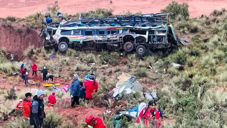 First responders work at the site and a destroyed bus is seen after rolling down a ravine following its crash with a vehicle along a highway in Lenas, Potosi, southern Bolivia, March 3, 2025, in this handout image obtained from social media. Bolivia's Attorney General/Handout via REUTERS THIS IMAGE HAS BEEN SUPPLIED BY A THIRD PARTY. NO RESALES. NO ARCHIVES. MANDATORY CREDIT