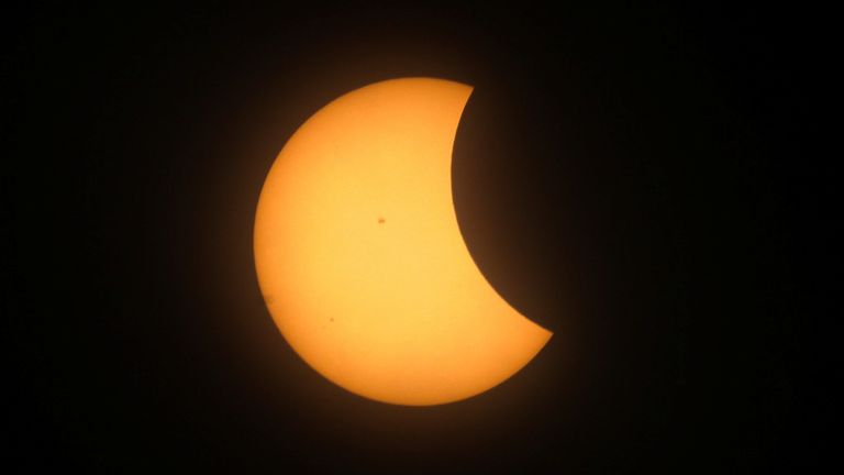 A partial solar eclipse is seen from Mazatlan, Mexico   Pic: Reuters