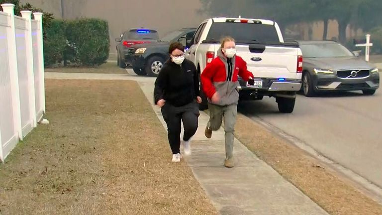 People flee an area in Myrtle Beach. Pic: AP      People move from an area where crews work to contain a fire in the Carolina Forest area west of the coastal resort city of Myrtle Beach, S.C., Sunday, March 2, 2025, where residents were ordered to evacuate several neighborhoods. (WMBF-TV via AP)