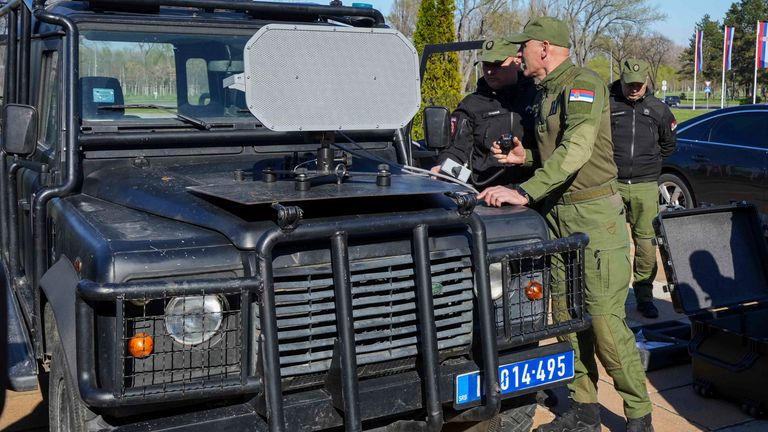In this photo provided by the Serbian Interior Ministry, Serbian Gendarmerie officers show the U.S.-made Long Range Acoustic Device (LRAD) ... which is illegal in Serbia and many other countries, in Belgrade, Serbia, Wednesday, March 19, 2025. (Serbian Ministry of Interior via AP)