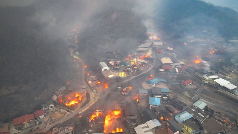 Smoke and flames rise from a wildfire in Andong, South Korea  Pic: Yonhap/Reuters