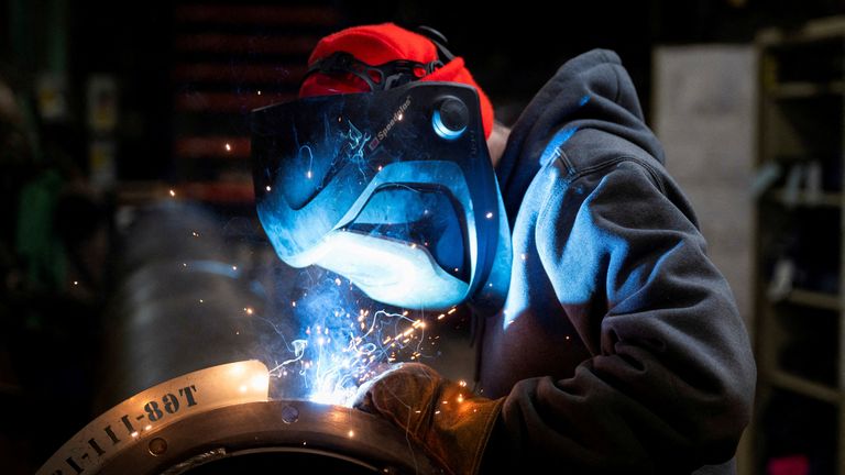 FILE PHOTO: A worker welds a steel tube at HCC, a company that uses parts to make combines, at the factory in Mendota, Illinois, U.S., February 21, 2025. REUTERS/Vincent Alban/File Photo