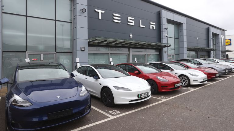 Cars on the forecourt of the Tesla dealership on the Boucher Road in Belfast. Police in south Belfast are appealing for information after a report was received on Sunday that damage had been caused to a large number of vehicles at commercial premises in the Boucher Road area. Picture date: Monday March 17, 2025.