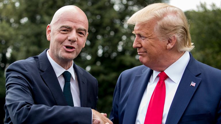 President Donald Trump, right, and FIFA president Gianni Infantino, left, shake hands in front of members of the media on the South Lawn of the White House in Washington, Monday, Sept. 9, 2019, (AP Photo/Andrew Harnik)