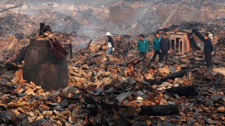 A bell is seen among the debris of the destroyed Gounsa Temple site in Uiseong. Pic: AP    (Kim Do-hoon/Yonhap via AP)
