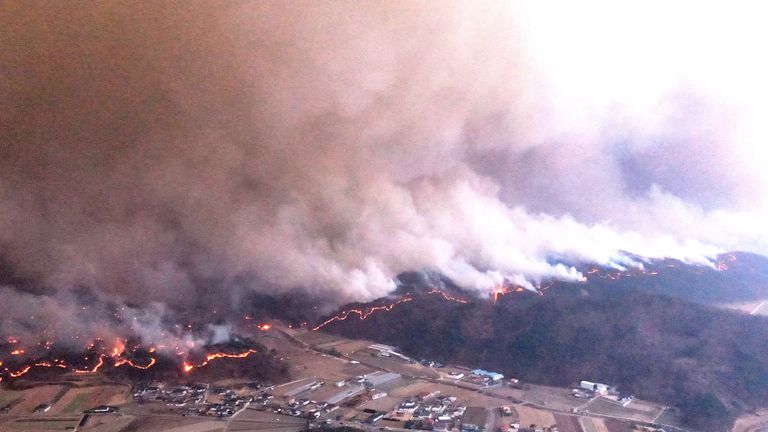 Smoke and flames rise from a wildfire in Andong, South Korea  Pic: Yonhap/Reuters