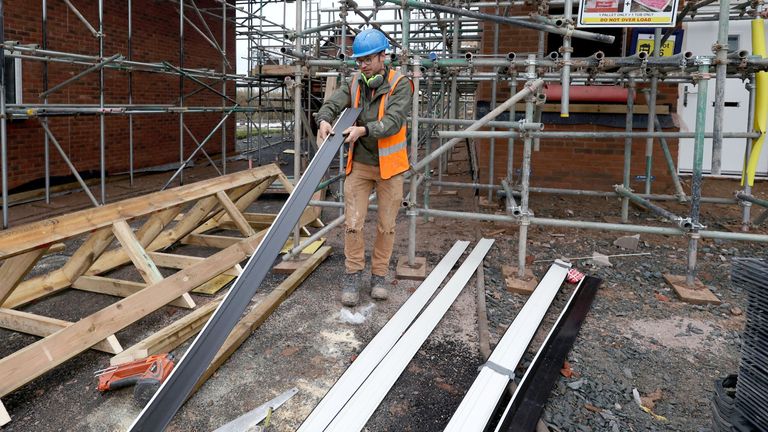 A construction worker works on the construction site of residential buildings in Worcester, Britain December 5, 2024. REUTERS/Temilade Adelaja