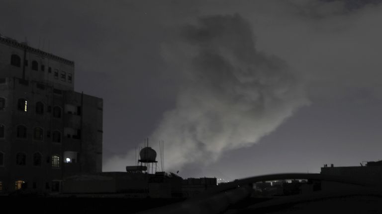Smoke rises from a location reportedly struck by US airstrikes. Pic: AP