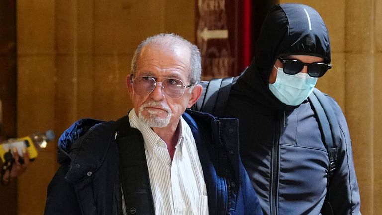Defendant Aomar A..t Khedache, left, one of the men accused in the 2016 armed robbery of Kim Kardashian, arrives at the palace of justice Monday, April 28, 2025 in Paris. (AP Photo/Aurelien Morissard)
