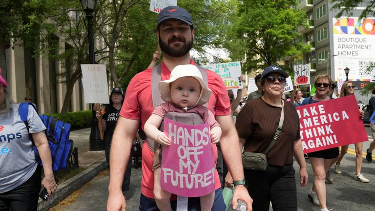 People take part in the nationwide anti-Trump “Hands Off” protest in Atlanta, Georgia U.S., April 5, 2025. REUTERS/ Megan Varner