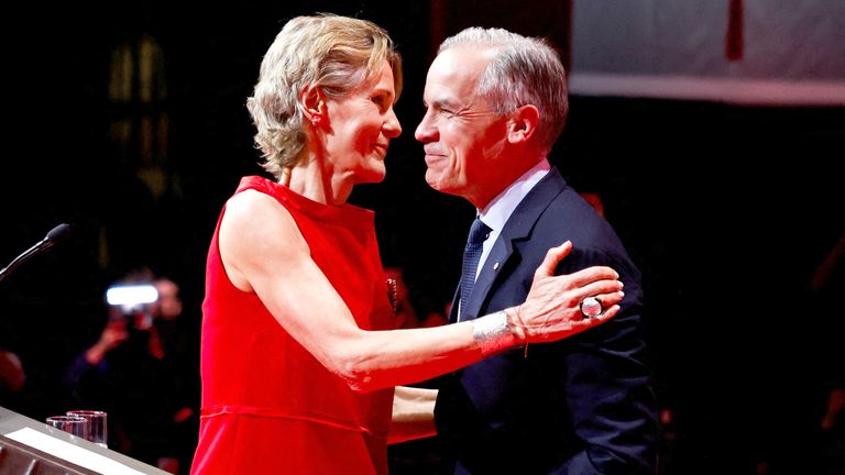 Canada's Prime Minister Mark Carney embraces his wife Diana Fox Carney at the Liberal Party election night headquarters in Ottawa, Ontario, Canada April 29, 2025. REUTERS/Carlos Osorio.