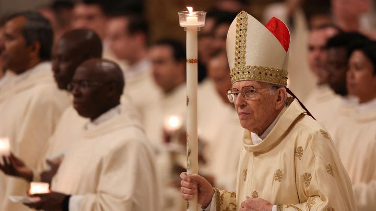 Cardinal Giovanni Battista Re presides over the Easter Vigil in Saint Peter's Basilica at the Vatican, April 19, 2025. REUTERS/Claudia Greco