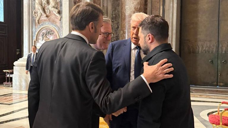 The world leaders share a moment before the service