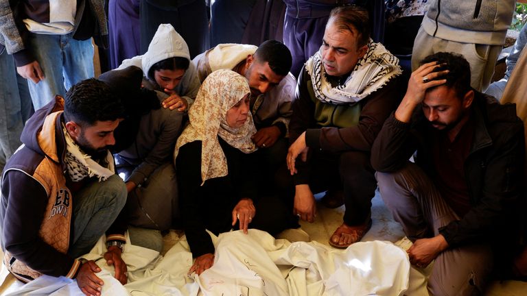 People mourn near the bodies of Palestinians killed in Israeli strikes, at Nasser hospital, in Khan Younis, in the southern Gaza Strip, April 19, 2025. REUTERS/Hatem Khaled