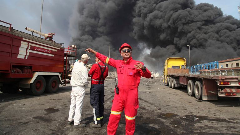 Emergency workers at the scene on Saturday. Pic: AP