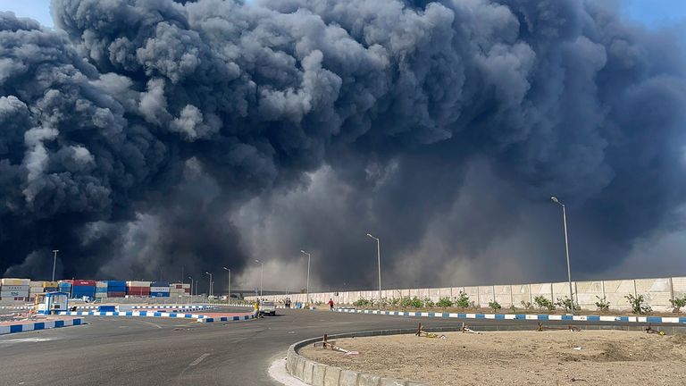 Smoke fills the sky after the port explosion. Pic: AP/ISNA