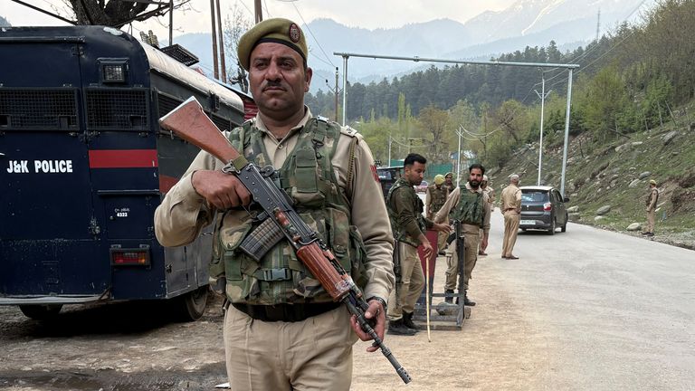 Indian police officers stand guard at a check point following a suspected militant attack, near Pahalgam in south Kashmir's Anantnag district, April 22, 2025. REUTERS/Stringer