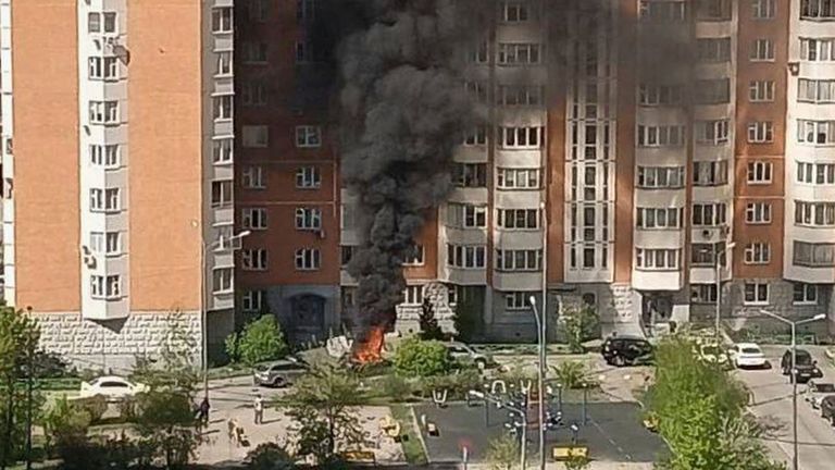 Flames and smoke rise from the scene where Lt Gen Yaroslav Moskalik was killed by a car bomb. Pic: OSTOROZHNO NOVOSTI via AP
