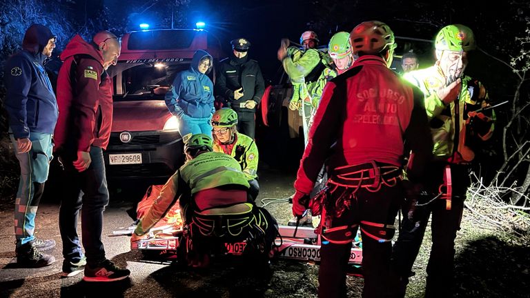 Rescuers on the site where a cable car carrying tourists south of Naples has crashed after the cable snapped.  Pic: AP