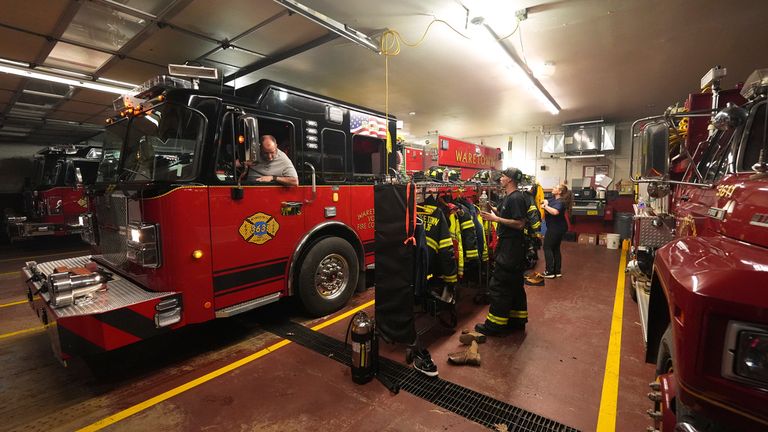 Waretown Volunteer Fire Company firefighters prepare to respond to a wildfire on Tuesday, April 22, 2025, in Waretown, N.J. (AP Photo/Chris Szagola)
