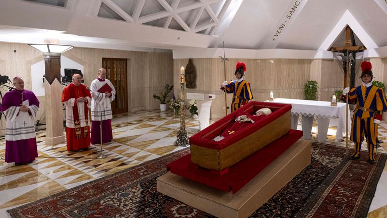 The body of Pope Francis is placed in an open casket during the rite of the declaration of death in Santa Marta residence at the Vatican, April 21, 2025. Vatican Media/­Handout via REUTERS ATTENTION EDITORS - THIS IMAGE WAS PROVIDED BY A THIRD PARTY. REFILE - CORRECTING DATE