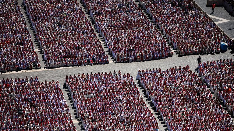 People attend the funeral Mass of Pope Francis at the Vatican, April 26, 2025. REUTERS/Yara Nardi