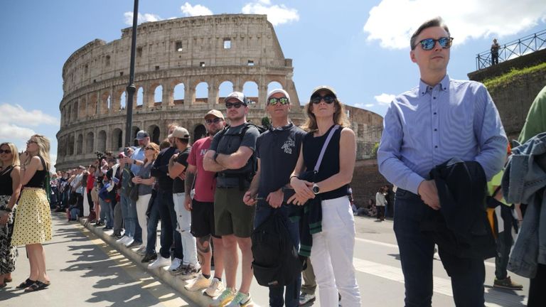People line the streets outside the Colosseum
