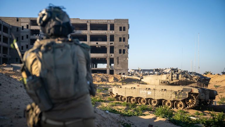 An Israeli soldier and IDF tank in front of an abandoned hospital in Rafah, 23 March Pic: IDF