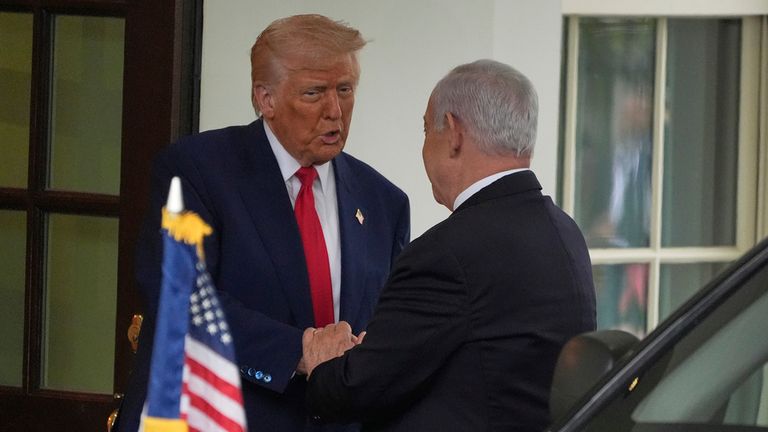 Donald Trump and Benjamin Netanyahu shake hands outside the White House. Pic: AP