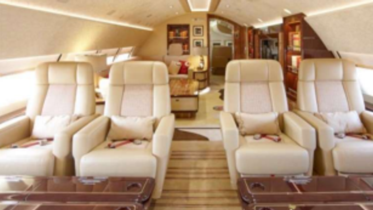 Inside the Qatari plane Mr Trump wants to use as a replacement for Air Force One. Four reclined seats with an open area behind them and a large tv.  Pic: Amac Aerospace