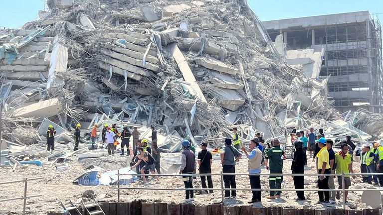 Rescuers work at the site of a collapsed building after the tremors of a strong earthquake that struck central Myanmar on Friday affected Bangkok, Thailand, March 28, 2025. REUTERS/Ann Wang