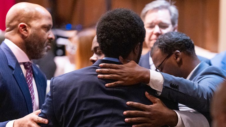 Former Memphis Police Department officers Demetrius Haley, center, Tadarrius Bean, left, and Justin Smith Jr., right, hug each other after they were acquitted of state charges, including second-degree murder, in the fatal beating of Tyre Nichols after he ran away from a traffic stop. Wednesday, May 7, 2025, in Memphis, Tenn. (Chris Day/Commercial Appeal/USA Today Network via AP, Pool)