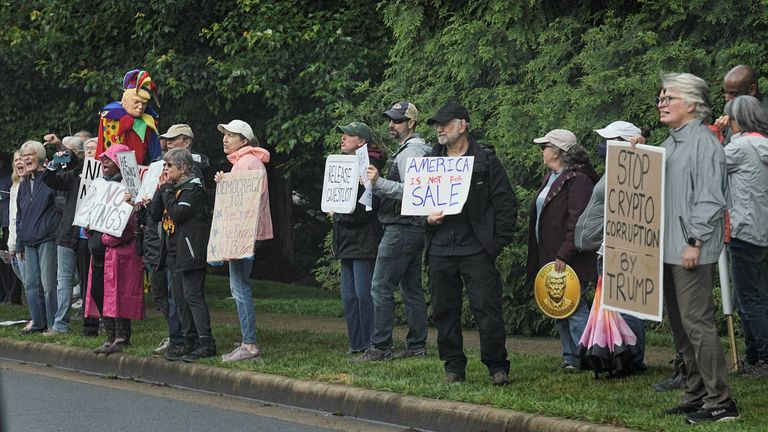 Demonstrators gather outside Trump National Golf Course ahead of U.S. President Donald Trump’s meme coin gala.  Pic: Reuters