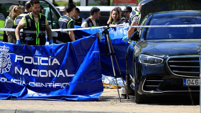 Members of the forensic team work at the scene where former Ukrainian politician Andriy Portnov  was shot by unidentified gunmen.  Pic: Reuters