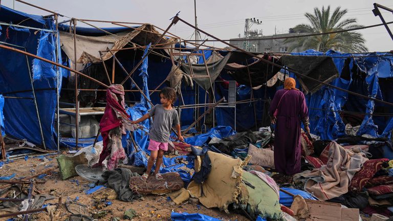 Palestinians inspect the damage caused by an Israeli airstrike that struck tents at Al-Aqsa Hospital in Deir al-Balah, central Gaza Strip, Saturday, May 17, 2025. (AP Photo/Abdel Kareem Hana)
