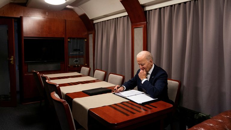 President Joe Biden sits on a train as he goes over his speech marking the one-year anniversary of the war in Ukraine after a surprise visit with Ukrainian President Volodymyr Zelenskiy, Monday, Feb. 20, 2023, in Kyiv. Evan Vucci/Pool via REUTERS