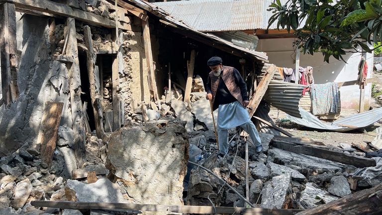 A Kashmiri villager examines damages to his house caused by overnight Indian shelling, in Shah Kot, in Neelum Valley, a district of Pakistan's administered Kashmir, Saturday, May 10, 2025. (AP Photo/M.D. Mughal)