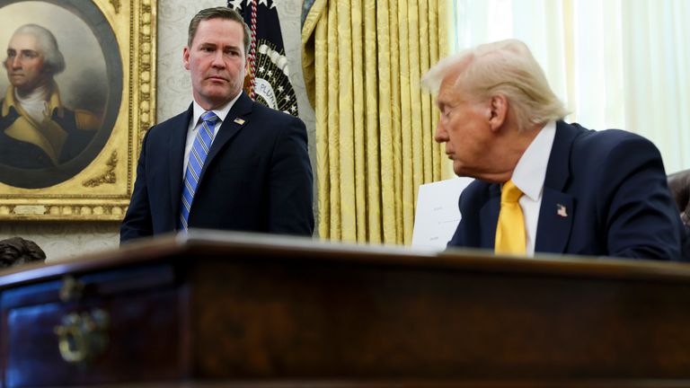 White House national security adviser Mike Waltz listens as President Donald Trump speaks in the Oval Office of the White House in Washington, Friday, March 7, 2025. (Pool via AP)