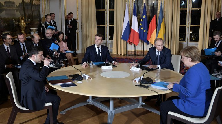 Russian President Vladimir Putin, French President Emmanuel Macron, German Chancellor Angela Merkel and Ukrainian President Volodymyr Zelenskiy attend a Normandy-format summit in Paris, France December 9, 2019. Sputnik/Alexei Nikolsky/Kremlin via REUTERS ATTENTION EDITORS - THIS IMAGE WAS PROVIDED BY A THIRD PARTY.