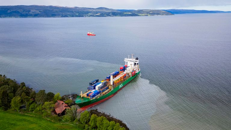 A container ship ran aground in the Trondheimsfjord, Trondheim, Norway.  Pic: AP