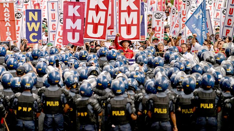 Protesters clash with the police during  Labour Day ademonstration in Manila, Philippines.  Pic: Reuters