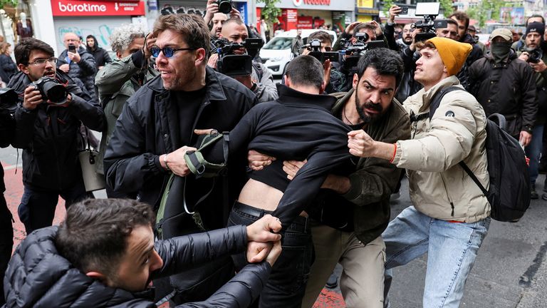 Plain-clothed police members detain a protester, as people attempt to defy a ban and march on Taksim Square to celebrate May Day in Istanbul, Turkey May 1, 2025. REUTERS/Umit Bektas
