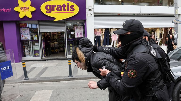 Members of the police hold a demonstrator, as people attempt to defy a ban and march on Taksim Square to celebrate May Day in Istanbul.  Pic: Reuters