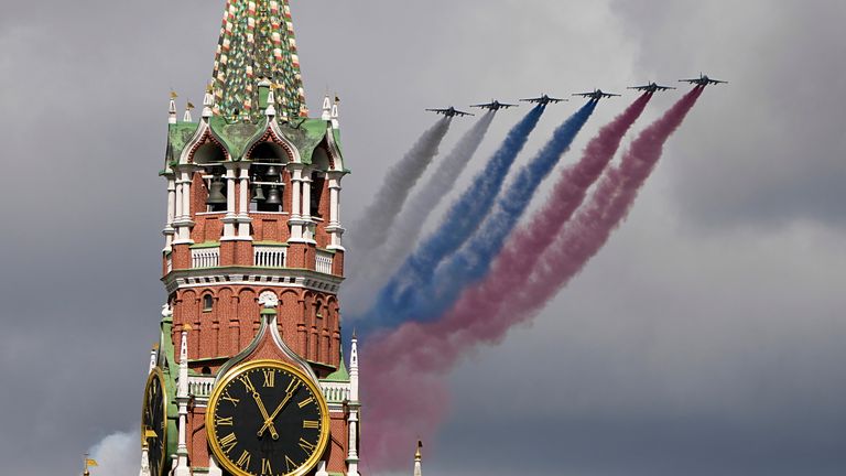 Russian Air Force fly over Red Square, leaving trails of smoke in the colors of the Russian national flag during rehearsal. Pic: AP/Alexander Zemlianichenko