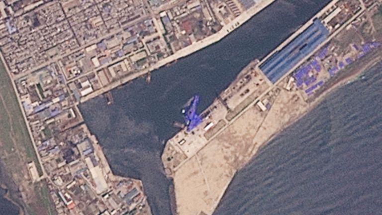 A satellite image shows the North Korean warship in water at shipyard after the launch accident.  Pic: Planet Labs/Reuters